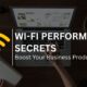 Person using laptop with Wi-Fi icon and text about boosting business productivity with better Wi-Fi.