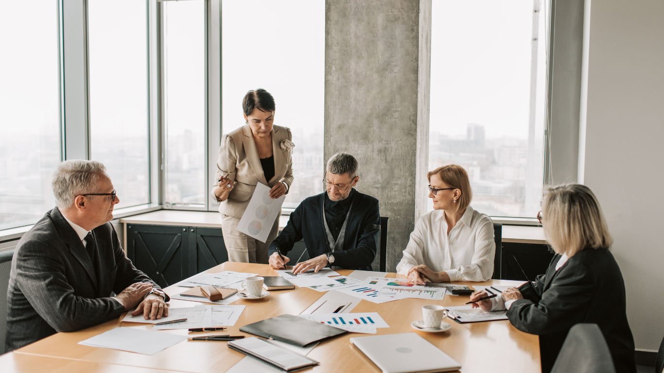 people having meeting in conference room